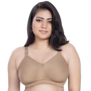 Woman wearing nude full coverage cotton bra with adjustable straps and seamless design